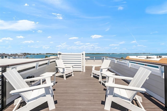 wooden deck featuring a water view