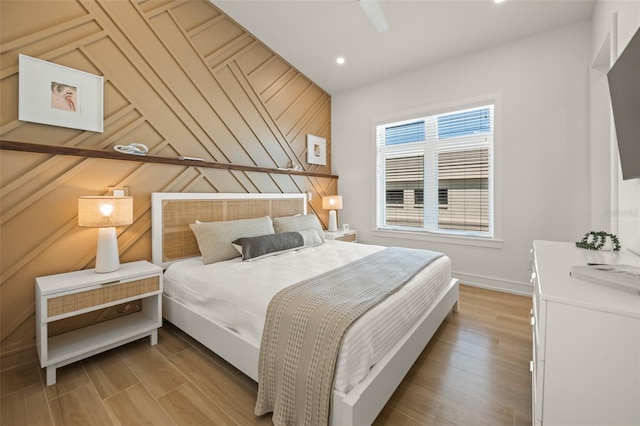 bedroom with light wood-type flooring and ceiling fan