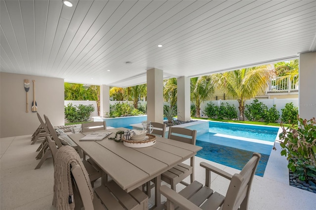 view of swimming pool featuring a patio area