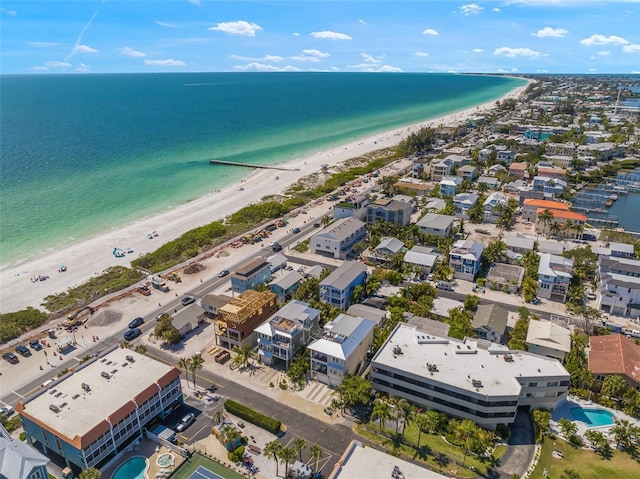 aerial view with a water view and a beach view