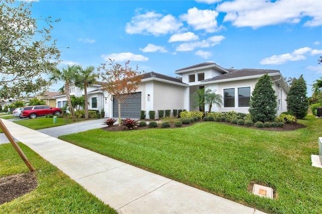 view of front facade with a garage and a front yard