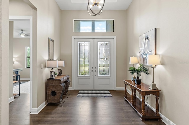 foyer featuring ceiling fan, dark hardwood / wood-style flooring, and french doors