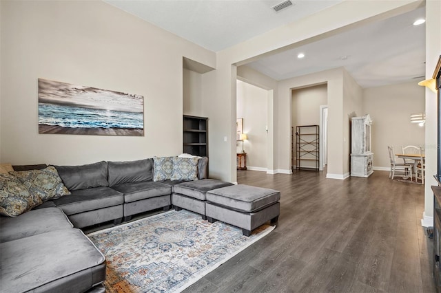 living room with dark wood-type flooring