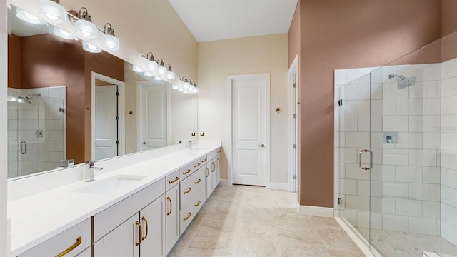 bathroom featuring tile patterned floors, a shower with shower door, and vanity