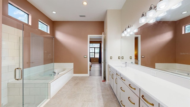 bathroom featuring tile patterned floors, vanity, and separate shower and tub