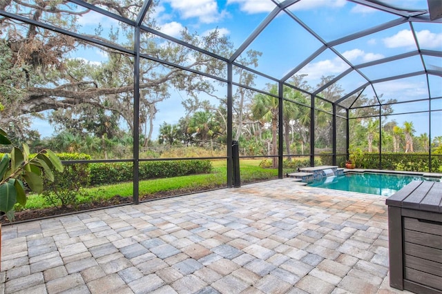 view of pool with a lanai and a patio area