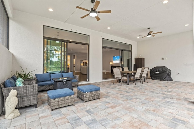 view of patio featuring ceiling fan and an outdoor living space