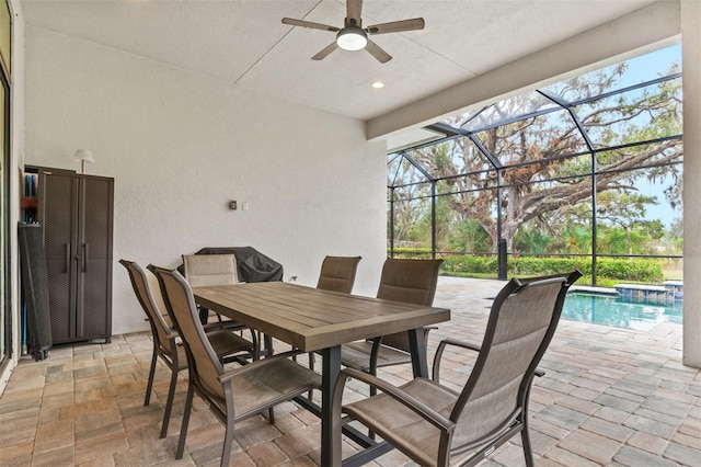 view of patio / terrace with glass enclosure and ceiling fan