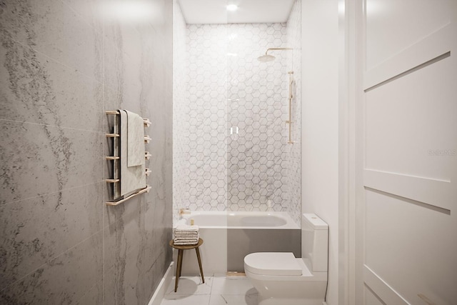 bathroom with bathing tub / shower combination and toilet