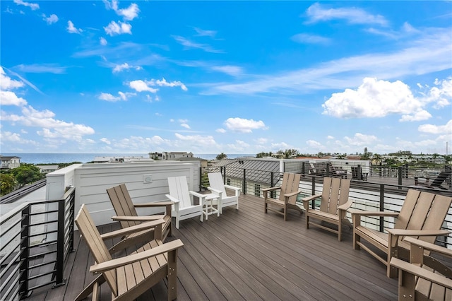 wooden deck featuring a water view