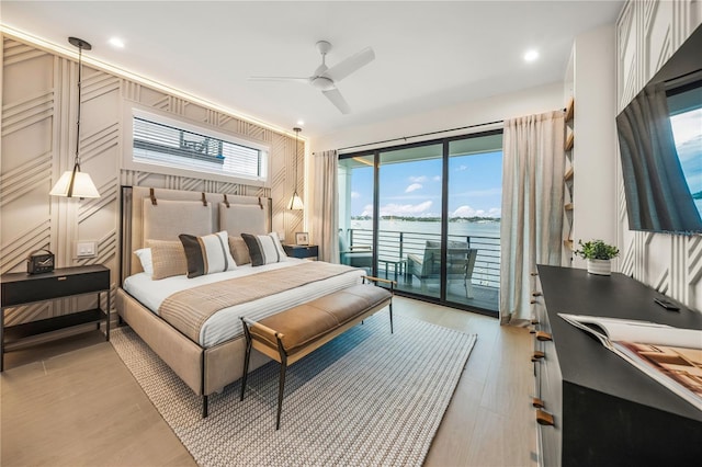 bedroom with ceiling fan, light hardwood / wood-style floors, and access to exterior