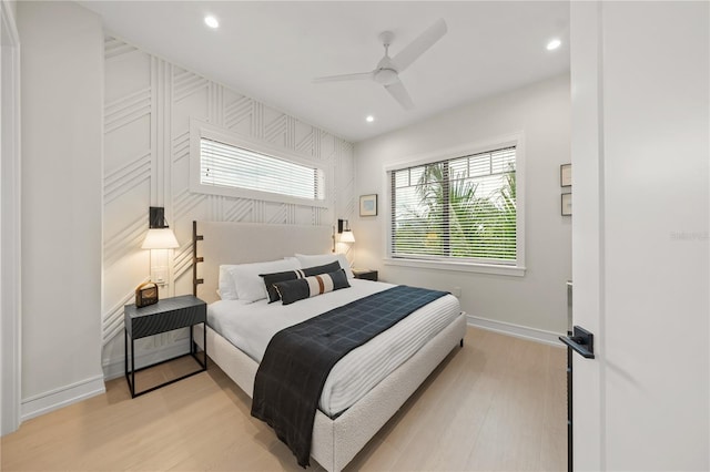 bedroom featuring light hardwood / wood-style flooring and ceiling fan