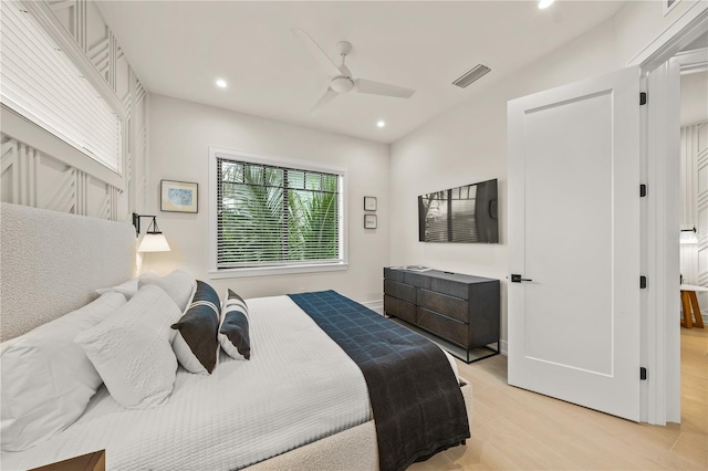 bedroom with ceiling fan and light hardwood / wood-style floors