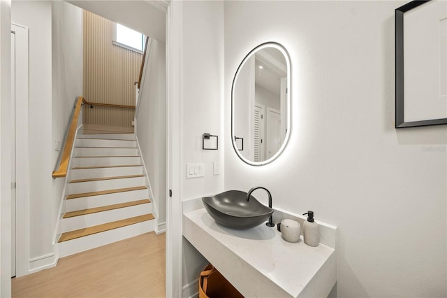 bathroom with sink and wood-type flooring