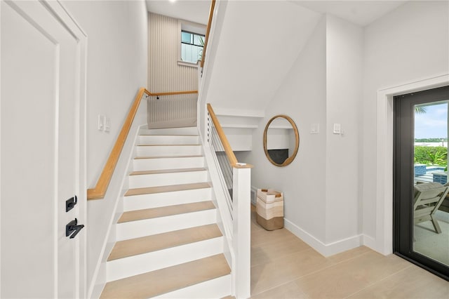 stairs featuring wood-type flooring