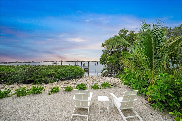 yard at dusk with a water view