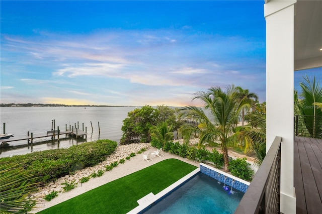 view of swimming pool with a water view