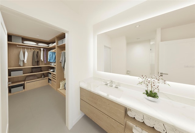 bathroom with tile patterned floors and vanity