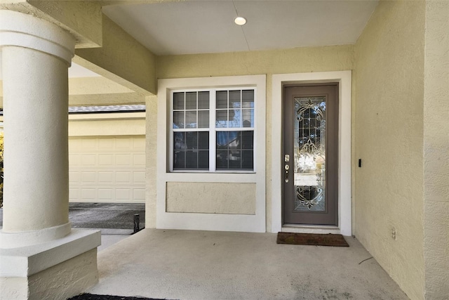 entrance to property with a garage