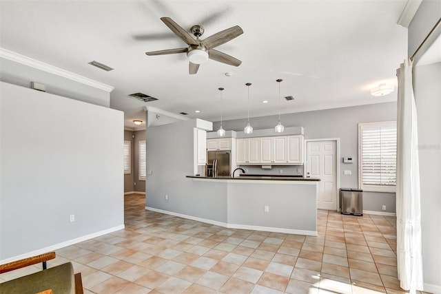 kitchen with light tile patterned flooring, white cabinetry, stainless steel fridge, pendant lighting, and ceiling fan