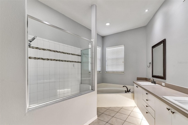 bathroom featuring tile patterned floors, plus walk in shower, and vanity