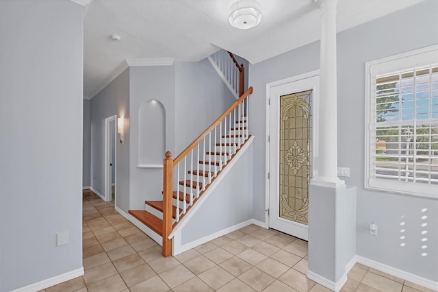 4708 Clipper Dr, Bradenton, FL 34208 - entrance foyer with light tile patterned floors, stairs, and ornate columns