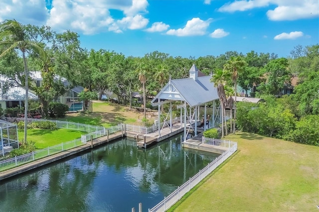 4708 Clipper Dr, Bradenton, FL 34208 - dock area featuring a water view, fence, and a lawn