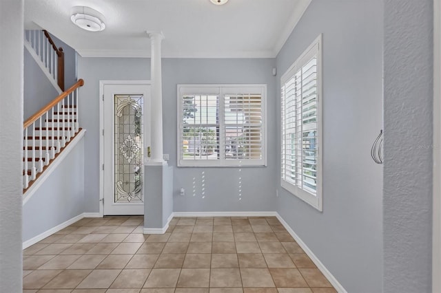 4708 Clipper Dr, Bradenton, FL 34208 - entryway featuring light tile patterned floors, stairs, ornamental molding, and plenty of natural light