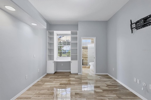 4708 Clipper Dr, Bradenton, FL 34208 - unfurnished bedroom featuring baseboards and ensuite bath