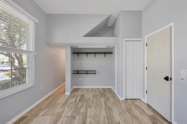 4708 Clipper Dr, Bradenton, FL 34208 - hallway with baseboards and light wood finished floors