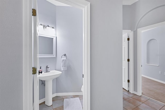 4708 Clipper Dr, Bradenton, FL 34208 - bathroom featuring a sink, tile patterned flooring, and baseboards