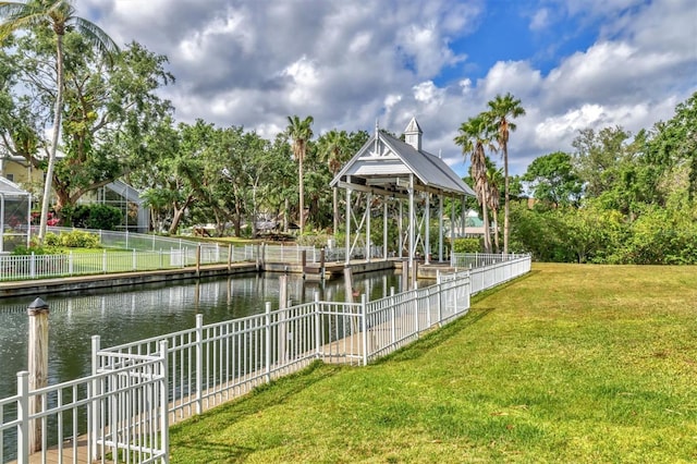 4708 Clipper Dr, Bradenton, FL 34208 - view of community with fence, a water view, and a lawn
