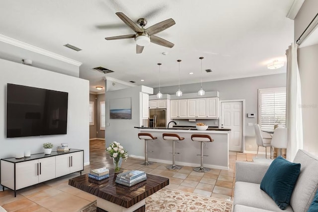 4708 Clipper Dr, Bradenton, FL 34208 - living area featuring ceiling fan, light tile patterned floors, and visible vents