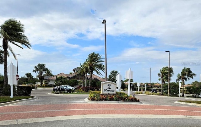 view of road with street lighting and traffic signs