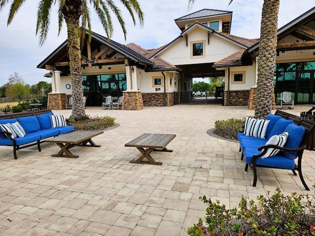 view of patio with driveway and outdoor lounge area