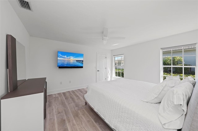 bedroom featuring light hardwood / wood-style flooring and ceiling fan