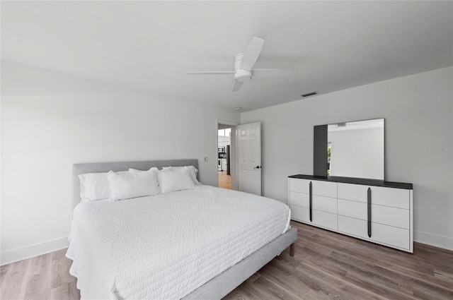 bedroom featuring hardwood / wood-style flooring and ceiling fan