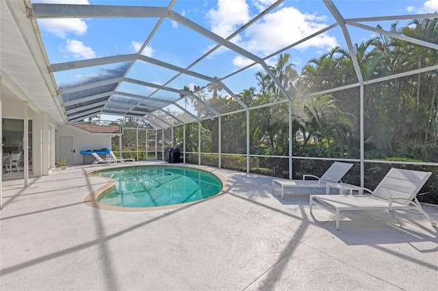 view of pool featuring a lanai and a patio area