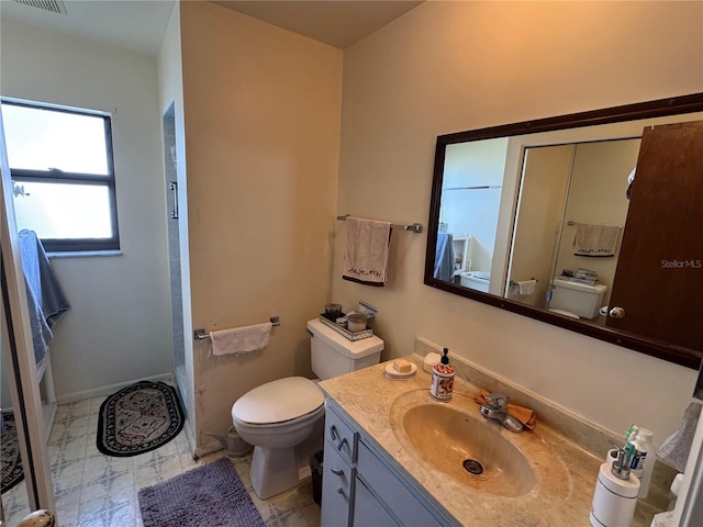 bathroom with vanity and toilet