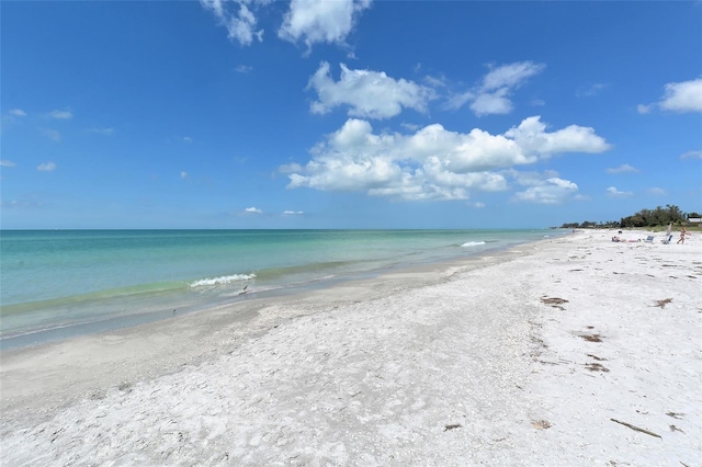 property view of water featuring a beach view