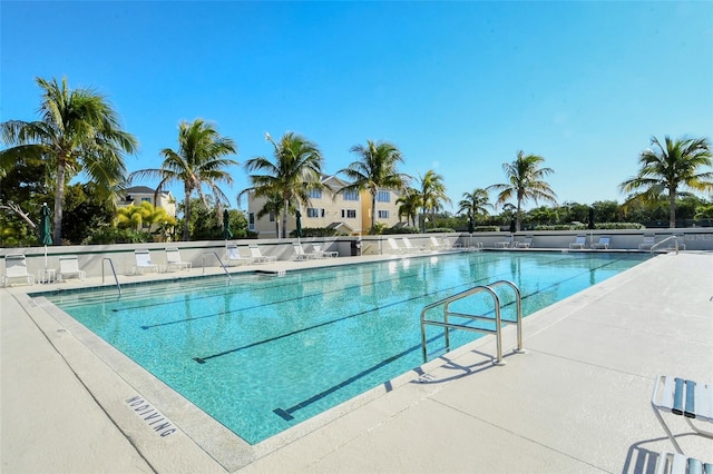 community pool with a patio area