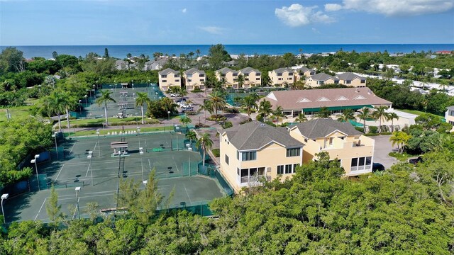 drone / aerial view featuring a water view and a residential view