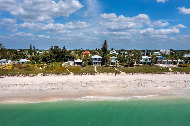 bird's eye view featuring a beach view and a water view