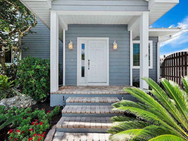 doorway to property featuring a porch