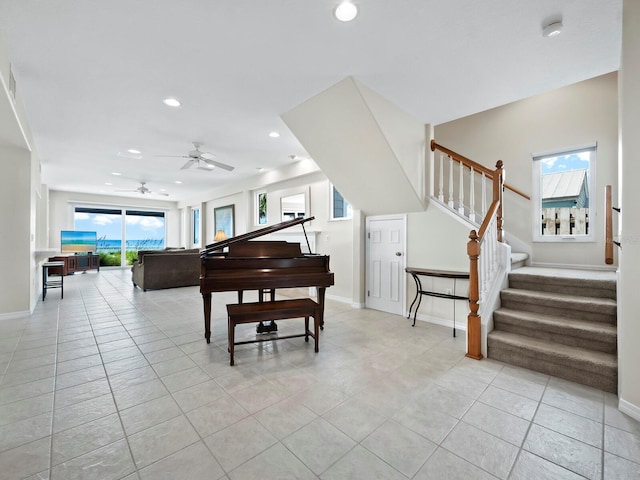 miscellaneous room featuring ceiling fan and light tile patterned floors