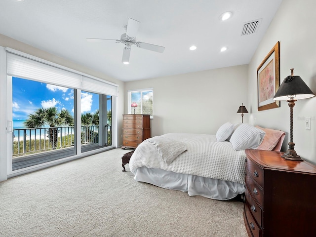 bedroom with access to outside, ceiling fan, and carpet