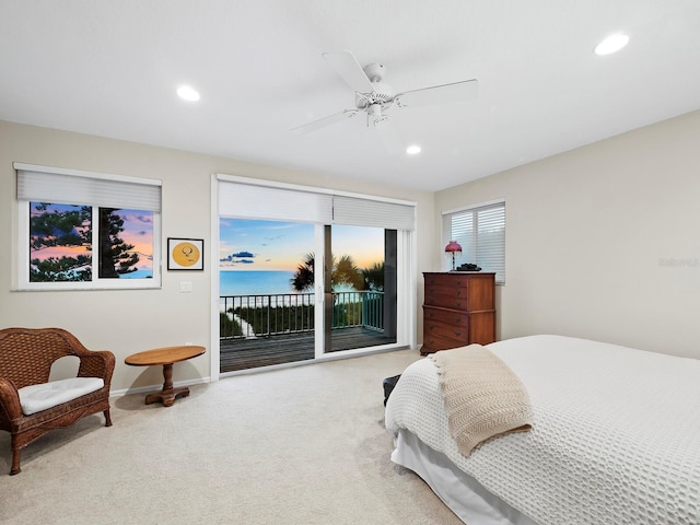 bedroom with access to exterior, ceiling fan, and light carpet