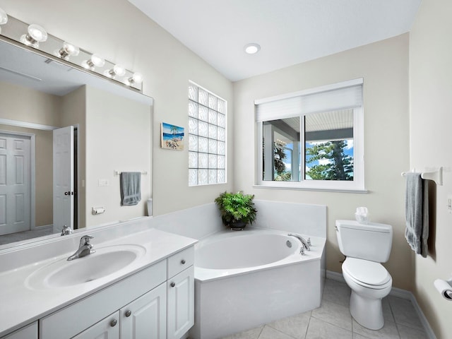 bathroom with a bathing tub, tile patterned flooring, vanity, and toilet