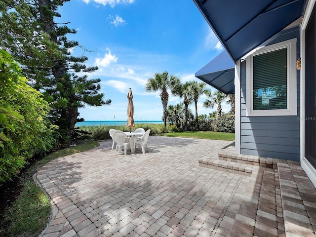 view of patio / terrace featuring a water view