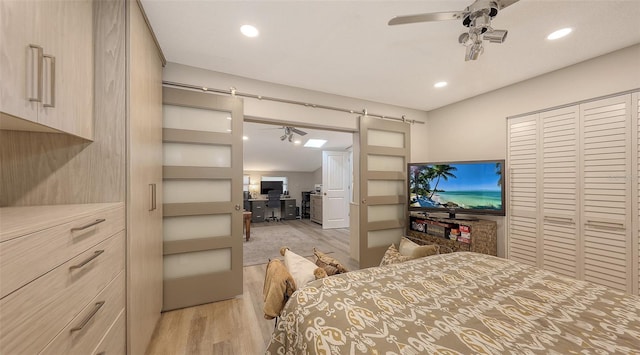 bedroom featuring ceiling fan and light wood-type flooring